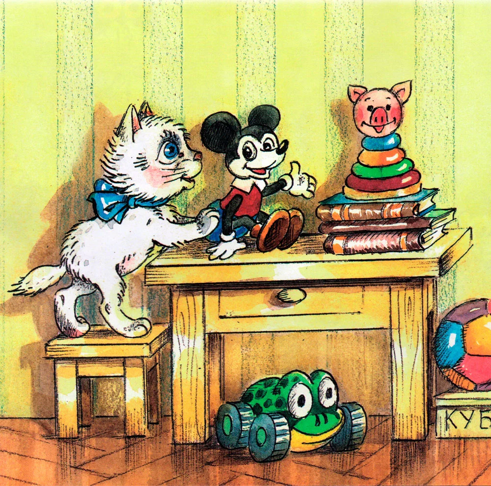 Котенок убирает игрушки