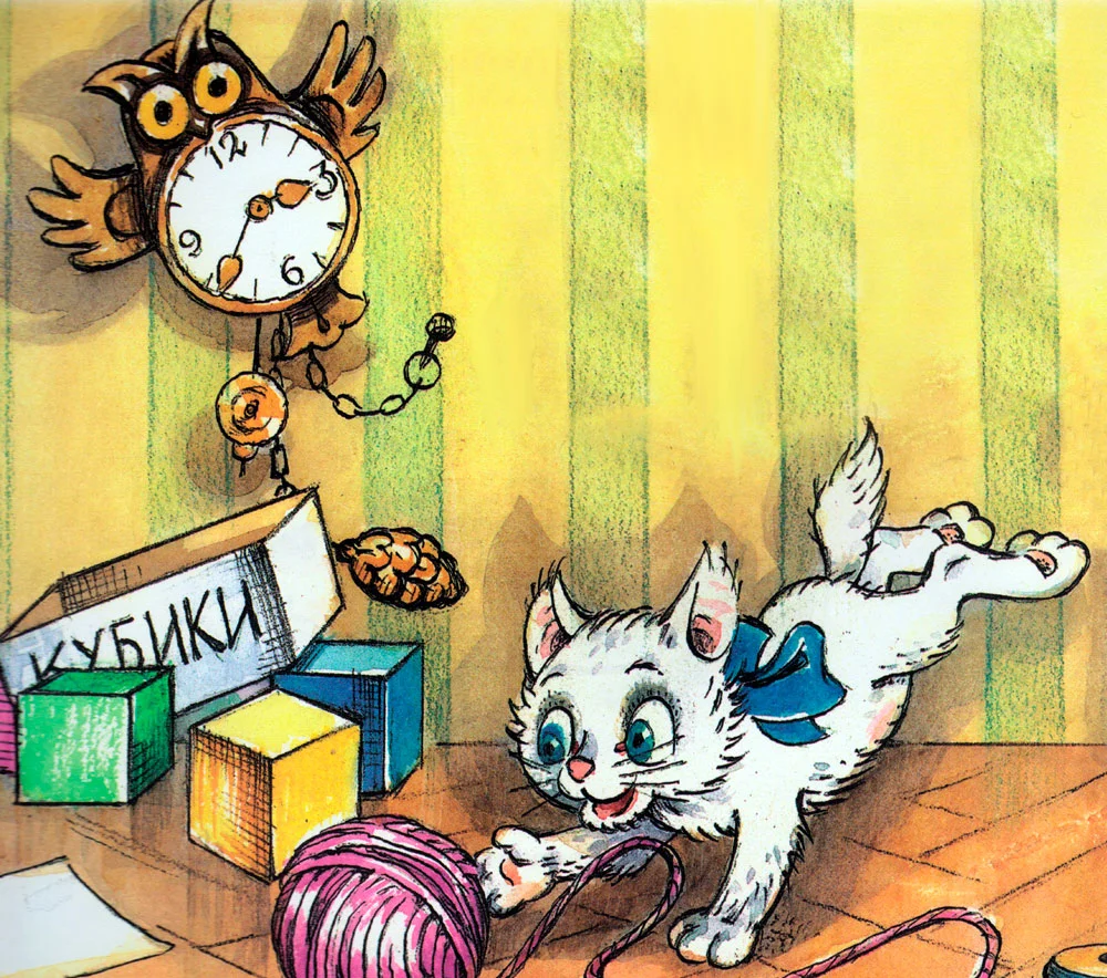 Котенок играет с клубком